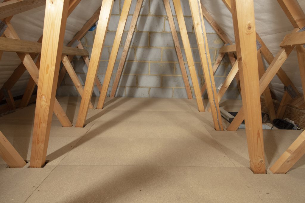 An attic with a fully boarded floor.