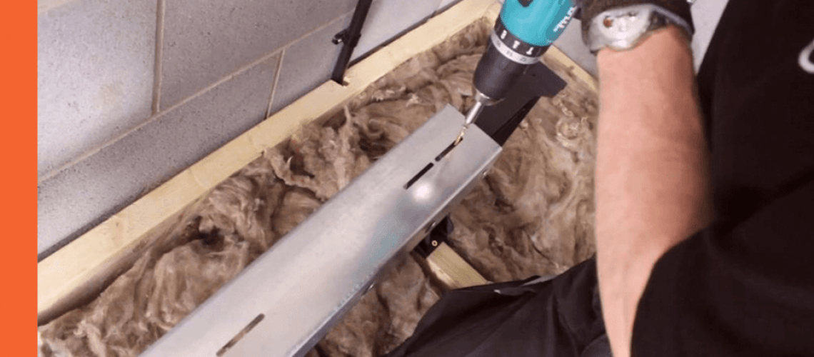 A person installing an attic floor boarding system.